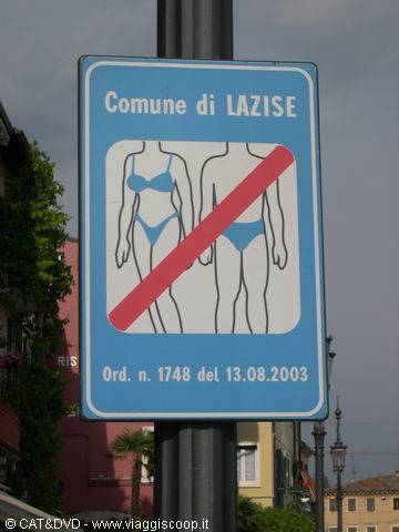 Blue sign in Lazise bans walking around in swimwear