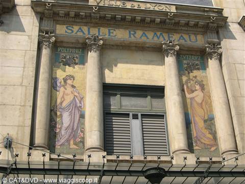 Facade of Salle Rameau in Lyon, with painted mosaics and stone columns