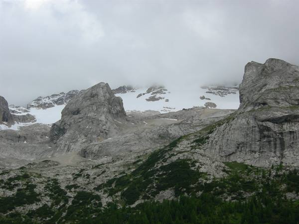 Glacier between rocky peaks in the fog, Marmolada