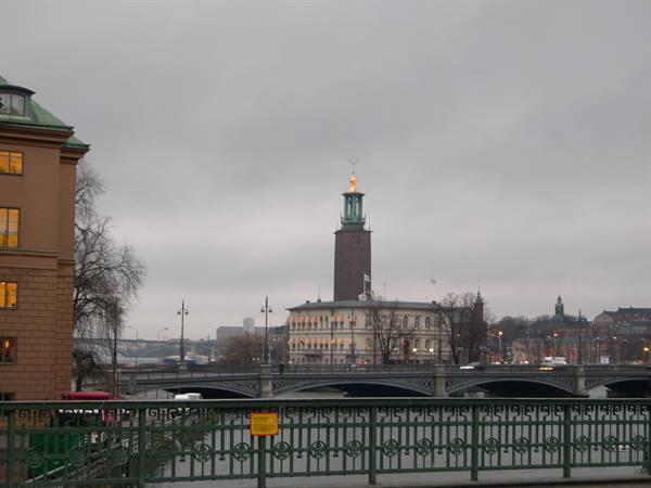 Stockholm City Hall with the three crowns tower under a grey sky