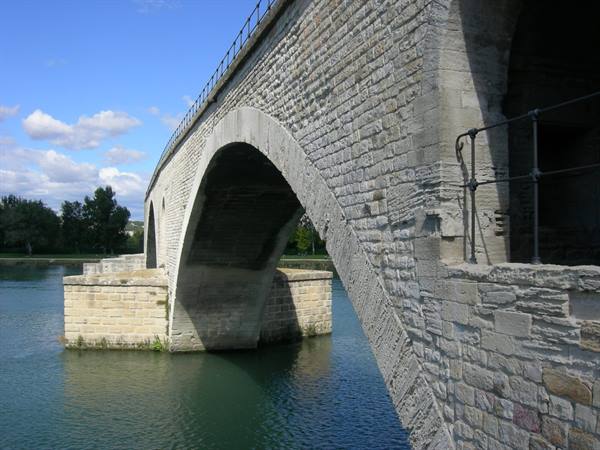 Stone arch of the Pont Saint-Bénézet in Avignon over the Rhône