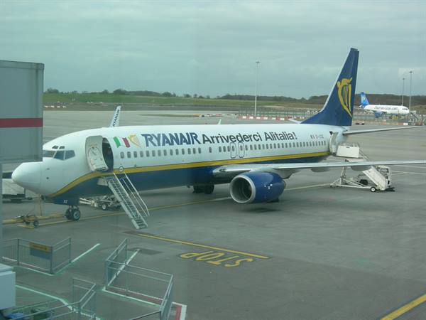 Ryanair plane with Arrivederci Alitalia livery, boarding stairs open on apron