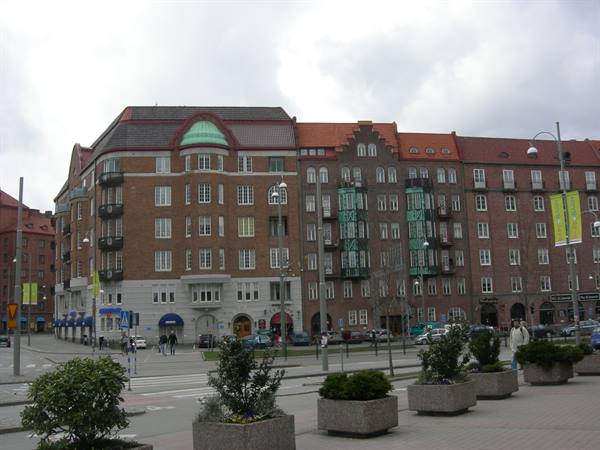 Red brick buildings with green roofs at Gustav Adolfs torg, Malmö