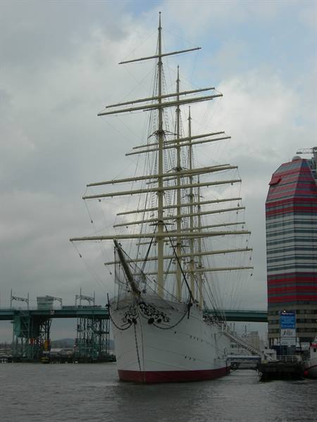 Nippon Maru tall ship moored at Yokohama harbor among skyscrapers