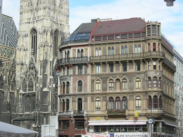 Historic building with McDonald's signs beside St. Stephen's Gothic cathedral, Vienna