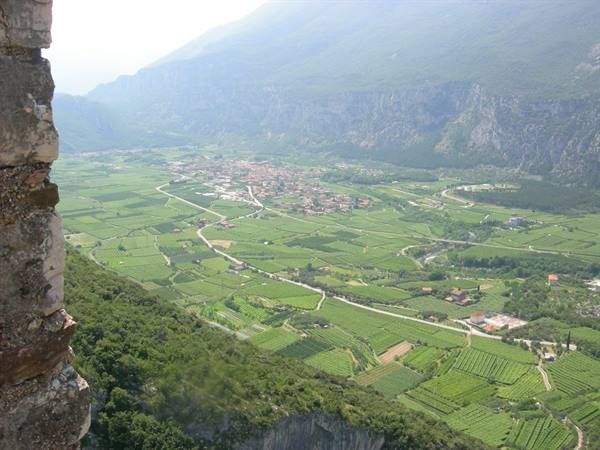 Vineyards and village on the valley floor seen from the stone fortress