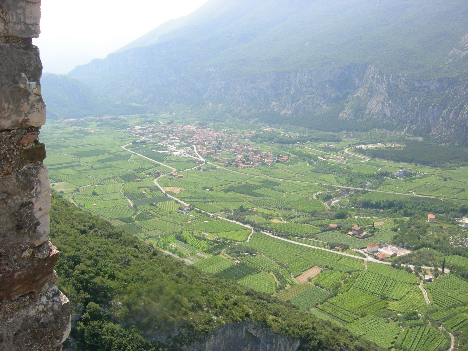 Vineyards and village on the valley floor seen from the stone fortress