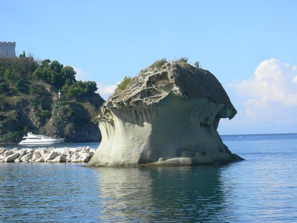 The Fungo rock formation at Lacco Ameno, Ischia, rising from blue sea