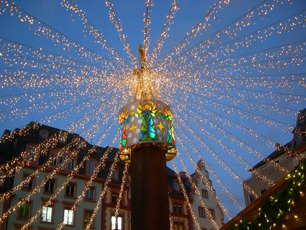 Radiating Christmas lights from a colorful angel crown, Mainz Christmas market