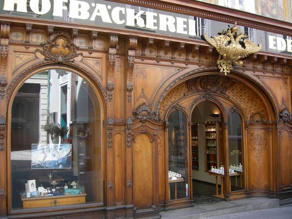 Carved wooden facade of the Hofbäckerei with golden eagle, Innsbruck
