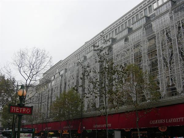 Art Nouveau facade of Galeries Lafayette in Paris with metro sign