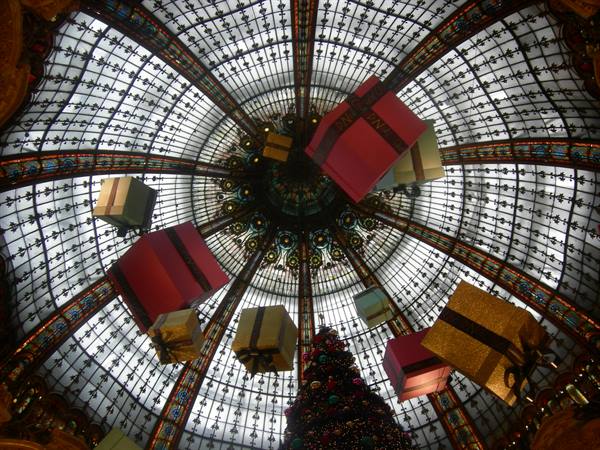 Suspended gift boxes beneath the stained glass dome of Galeries Lafayette