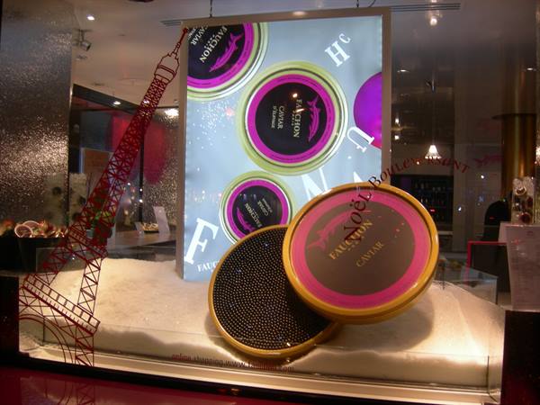 Fauchon shop window in Paris with caviar tins and red Eiffel Tower
