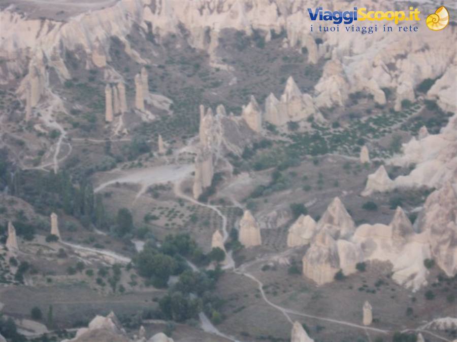 Cappadocia: fairy chimneys carved in volcanic rock among paths and greenery