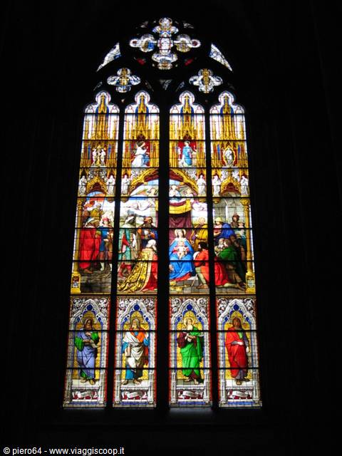 Polychrome Gothic stained glass window with saints and sacred scenes, Cologne Cathedral