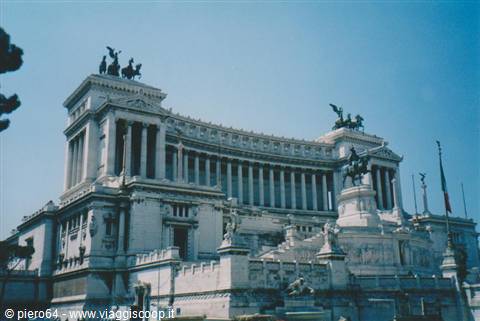 The Vittoriano white marble monument in Rome, bronze chariots against blue sky