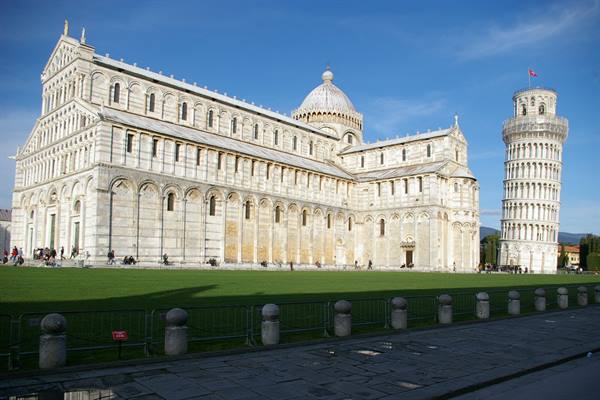 Pisa Cathedral and Leaning Tower in white marble under blue sky