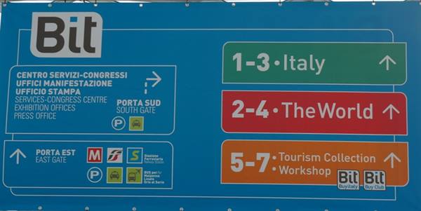 Blue directional sign of the Bit trade fair with Italy, World and Tourism Collection sectors