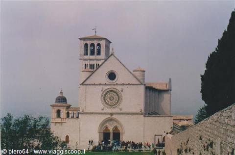 Tourists on the staircase of the Basilica of San Francesco in Assisi, gray sky