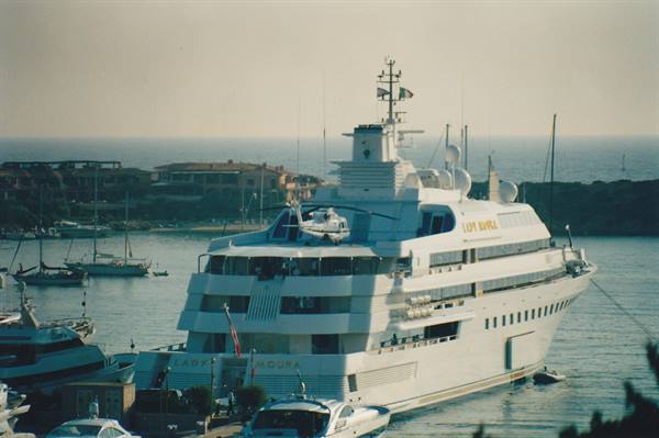 Lady Moura superyacht moored at Porto Cervo marina, helicopter on stern