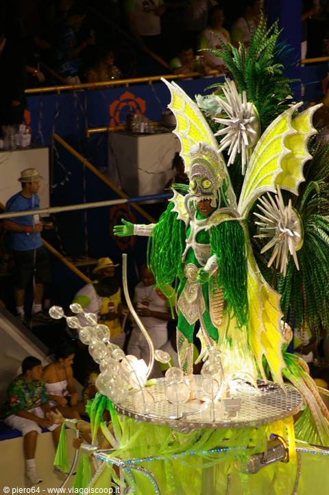 Dancer in green and yellow glittering winged costume at Rio Carnival
