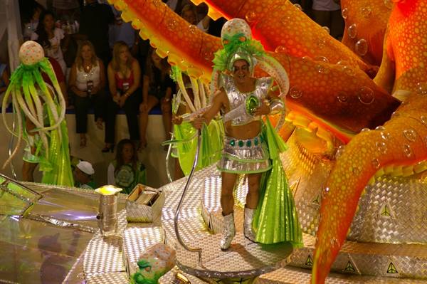 Dancer in silver costume on octopus float at Rio de Janeiro carnival