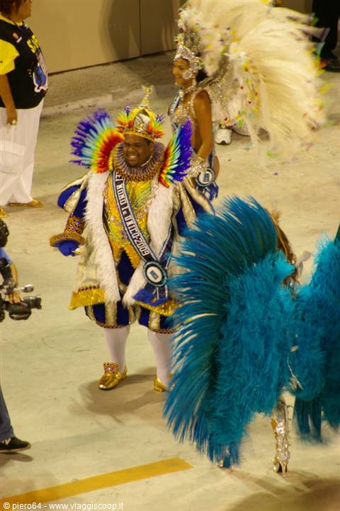 Dancers in colorful feather costumes parade at Rio's sambodrome
