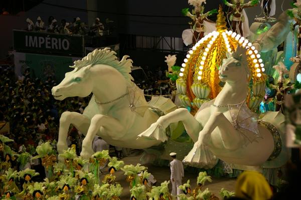 Float with white horses and golden lit dome at Rio carnival