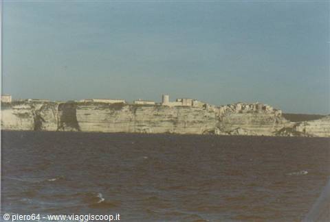 Bonifacio: old town atop white limestone cliffs seen from the sea