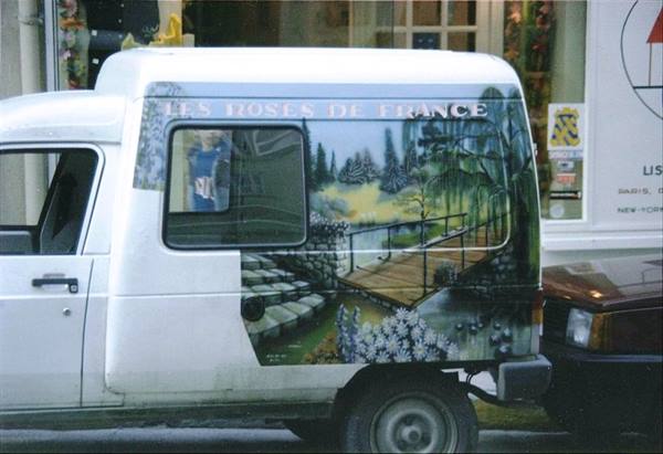 White van hand-painted with garden and bridge, reading Les Roses de France