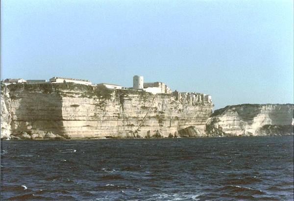 Citadel and houses atop Bonifacio's limestone cliffs above the sea