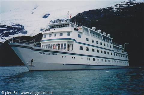 Terra Australis ship sailing among snowy mountains and glacial water
