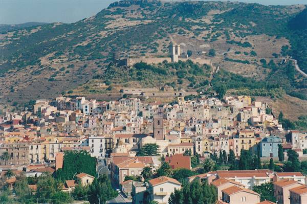 Bosa: colorful houses beneath the Serravalle castle on the hill