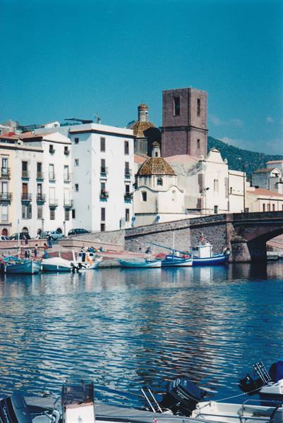 Bosa, small boats on the Temo river in front of old houses