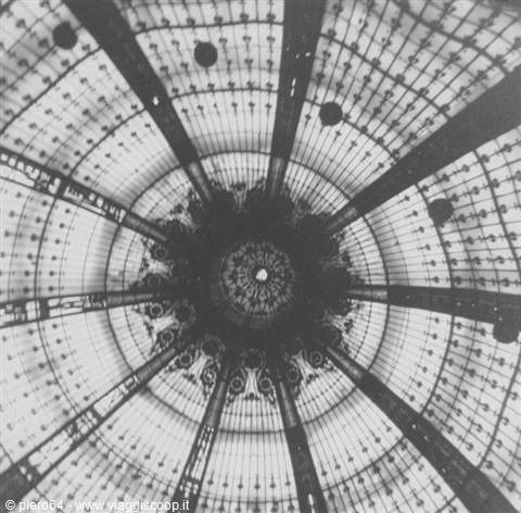 Glass and iron dome seen from below, light filtering through radial structure
