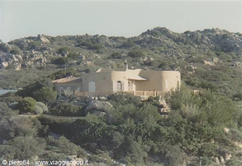 White villa among Mediterranean shrubs and granite rocks, Sardinian coast