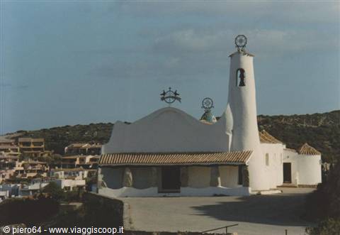 White concrete church with curved bell tower at Porto Cervo, daylight