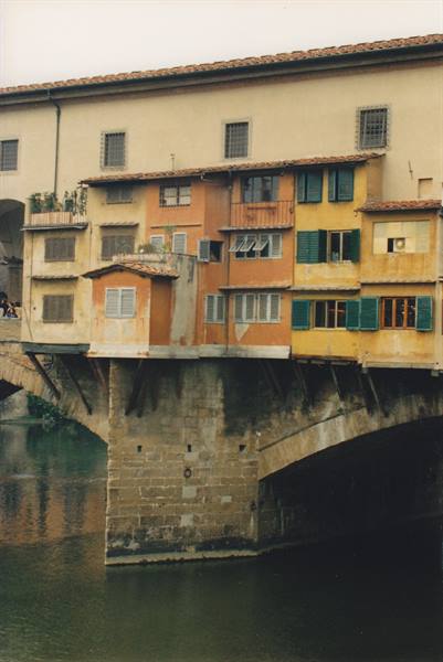 Ponte Vecchio in Florence, colorful houses overhanging the Arno