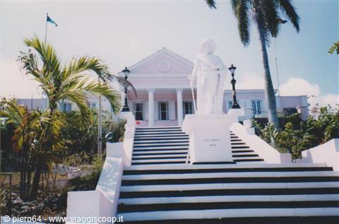 Columbus statue in front of Government House in Nassau, white staircase and palms