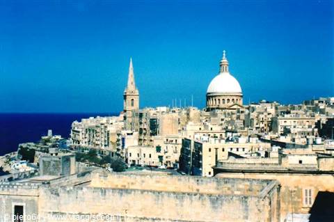The Carmelite dome and Anglican spire rising above Valletta's limestone rooftops