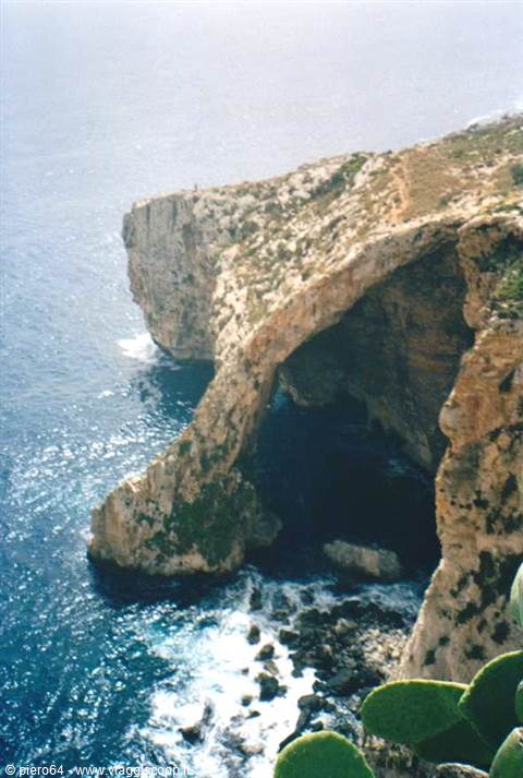The Blue Grotto rock arch plunges into Malta's deep blue sea