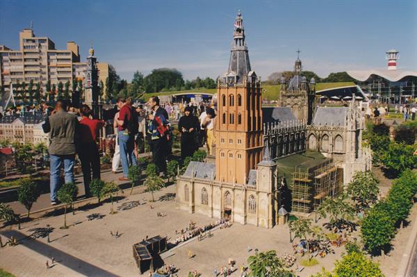 Visitors admire the miniature cathedral at Madurodam park