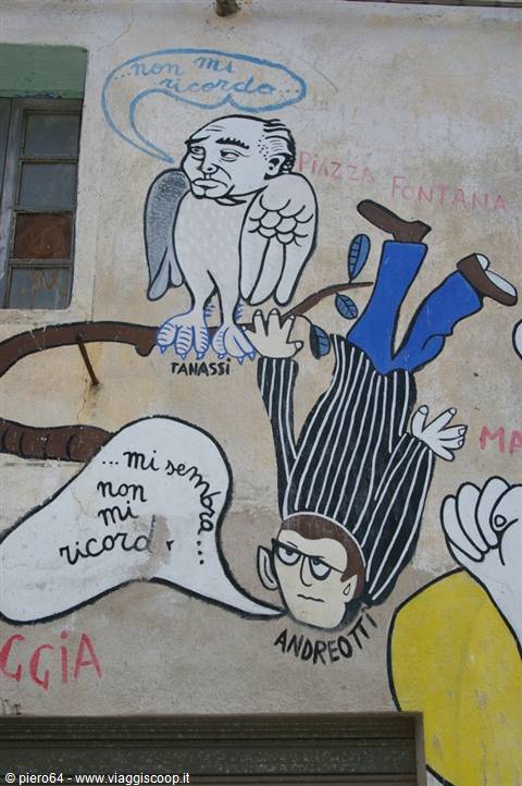 Satirical mural on wall: Andreotti falling from tree, Tanassi owl, painted slogans
