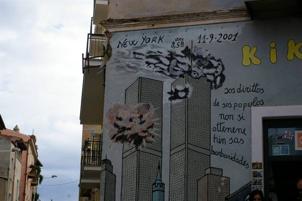 Mural on building wall commemorates September 11, 2001 with Twin Towers and painted smoke