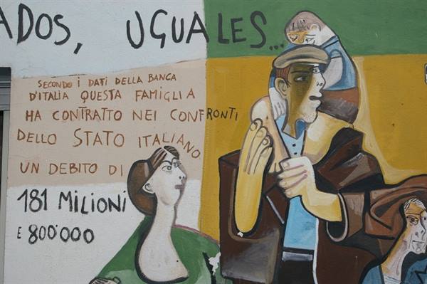 Painted mural with family figures and writings about Italy's state debt