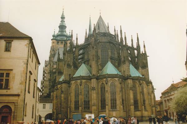 Tourists beneath the gothic apse of St Vitus Cathedral, Prague