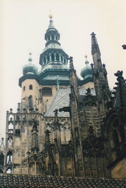 Gothic spires of Prague Cathedral against a grey sky
