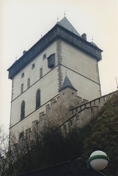 White stone tower with dark roof at Karlštejn Castle