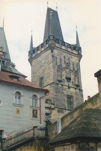 The Gothic Old Town Bridge Tower in Prague with tiled roofs