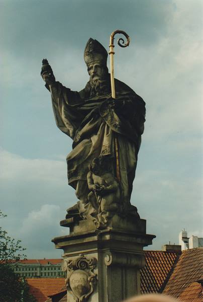Stone statue of a bishop with mitre and crosier, Charles Bridge, Prague
